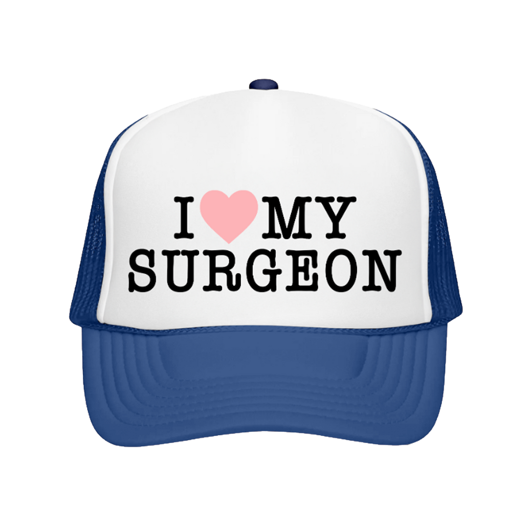 Blue and white cap with 'I ❤️ MY SURGEON' text on a white background