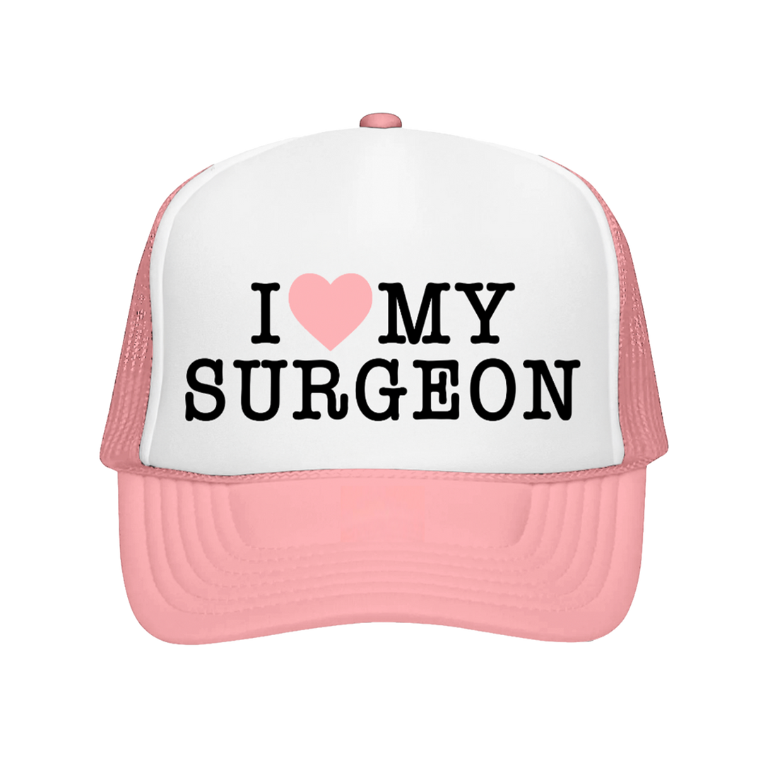 Pink and white cap with 'I ❤️ MY SURGEON' text on a white background